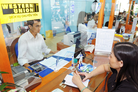 Các tổ chức nước ngoài phản ứng tích cực trước việc Ngân hàng Nhà nước điều chỉnh tỉ giá